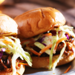 Pulled Pork Sandwich with Black Pepper Vinegar Sauce and Green Onion Slaw