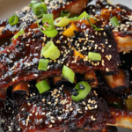 Bobby Flay Asian Spice Rubbed Ribs with Pineapple-Ginger BBQ Sauce and Black and White Sesame Seeds