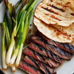 Bobby Flay Korean-Style Marinated Skirt Steak with Grilled Scallions and Warm Tortillas