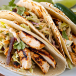 Bobby Flay Spice-Rubbed Chicken Breast Tacos with Grilled Poblanos, BBQ Onions and Coleslaw