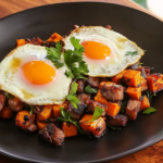 Jerk Pork Belly and Sweet Potato Hash with Fried Eggs