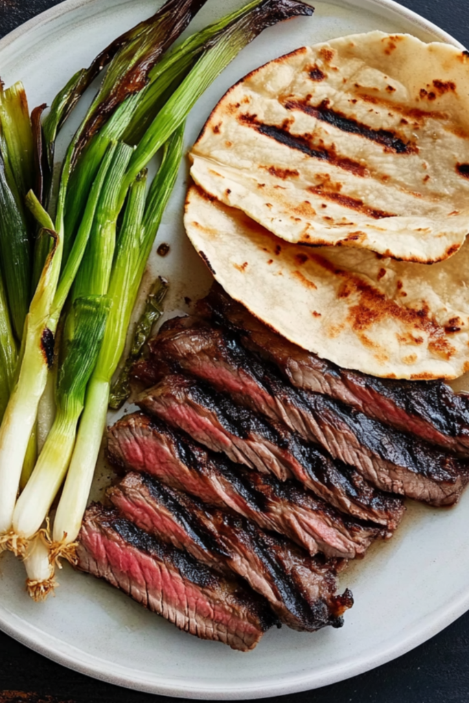 Bobby Flay Korean-Style Marinated Skirt Steak with Grilled Scallions and Warm Tortillas